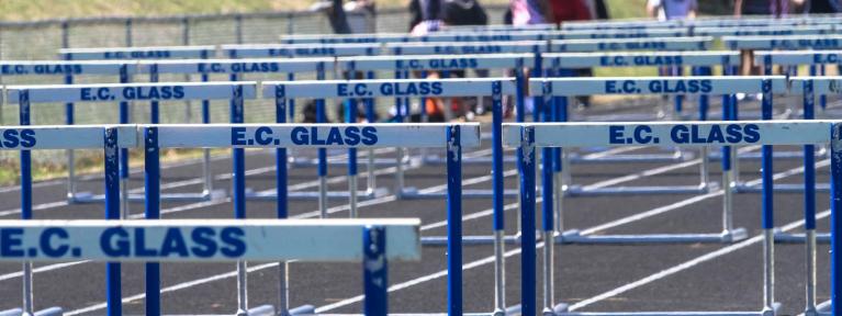 Track hurdles labeled E.C. Glass 