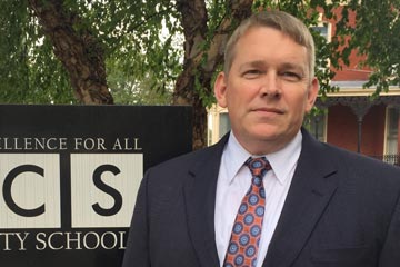 Ben Copeland standing outside School Administration Building