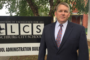 Mr. Copeland standing in front of LCS sign