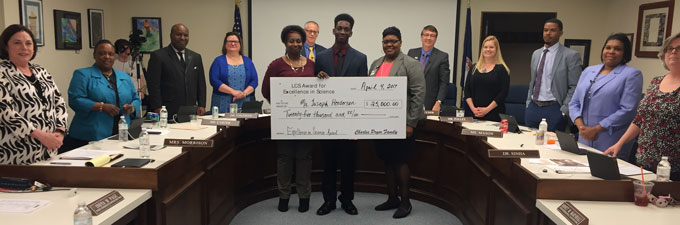 Joseph Henderson with LCS School Board during Charles Pryor Scholarship award ceremony.