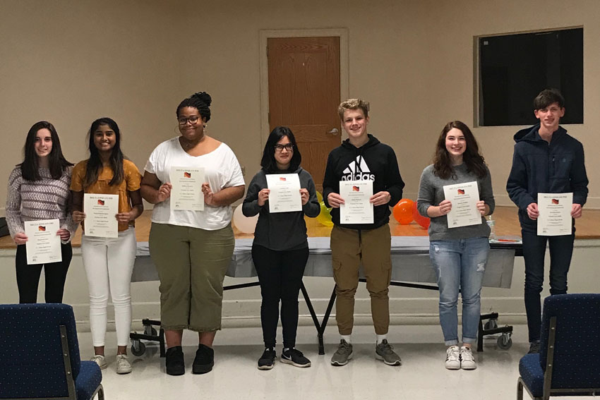 Students holding German Honor Society certificates