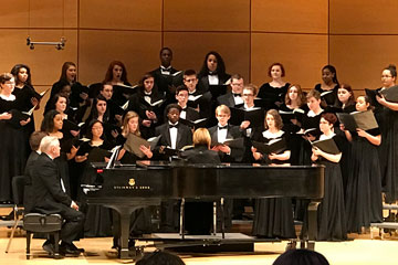 Chamber singers on stage performing