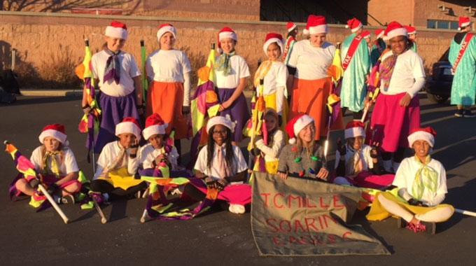 TCM flag and dance corps at start of holiday parade