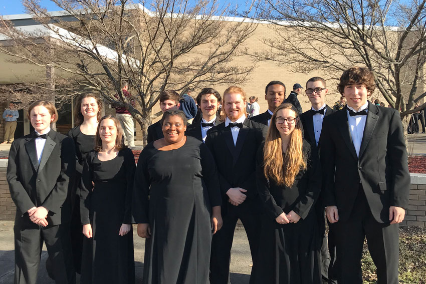 Honor band students standing outside in concert attire
