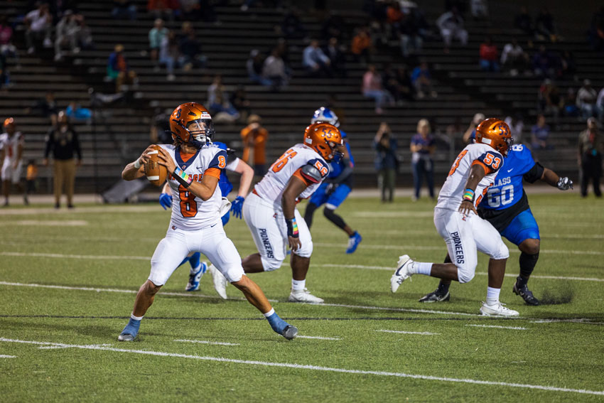 Heritage quarterback preparing to pass the ball during a football game