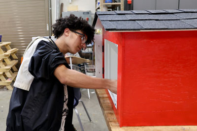 Student working on Little Free Library