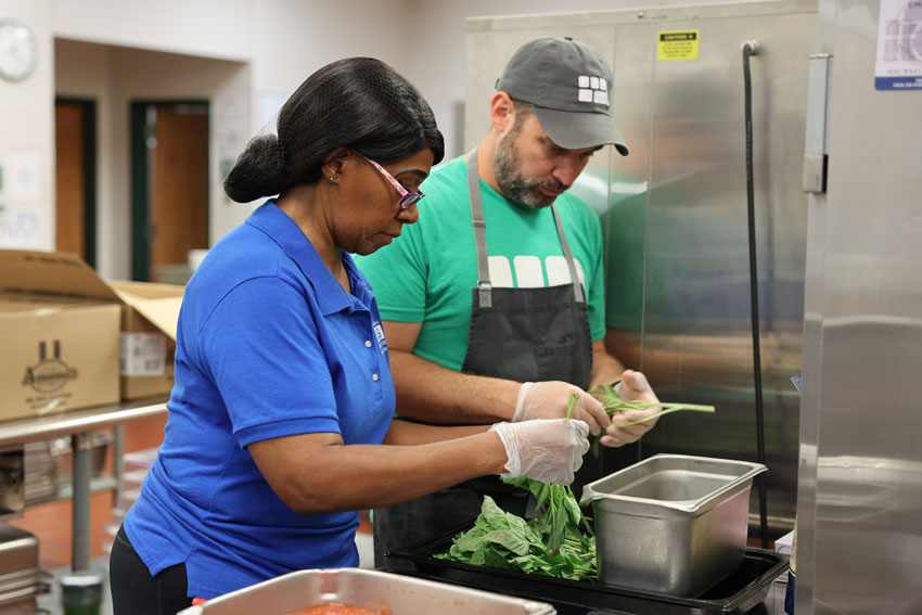 Brigaid chef with LCS school nutrition worker