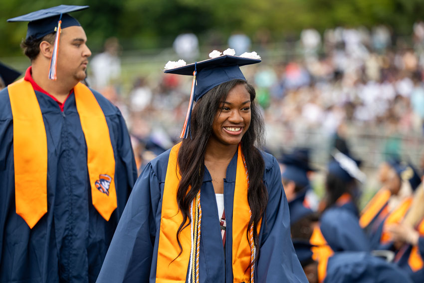 Akera Molette in cap and gown at graduation ceremony