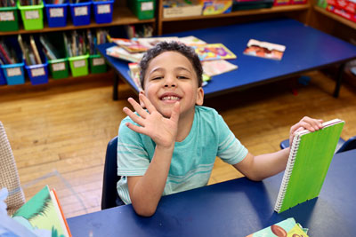 Smiling student with a book