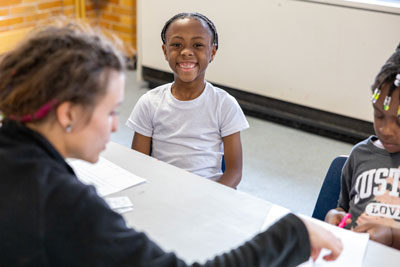 Smiling student at table