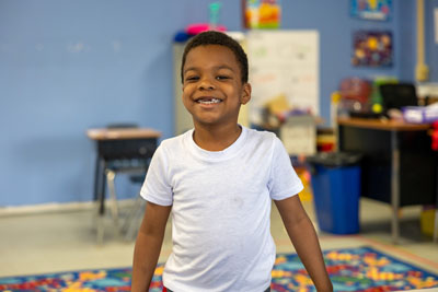 Student smiling in classroom