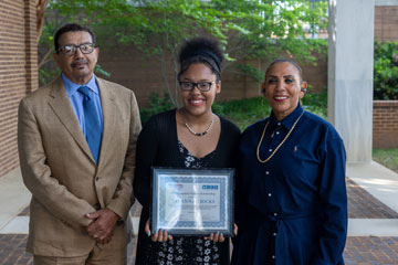 Scholarship recipient Savannah Hicks with donors Linda Carr and Clarence James