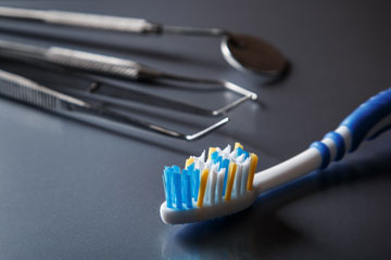 Toothbrush and dental equipment