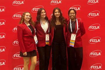 4 students in front of FCCLA backdrop