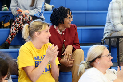 Dr. Kristy Somerville-Midgette in stands during basketball game