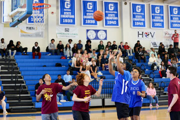 ECG basketball player shooting ball against "Swishin' Stingers"