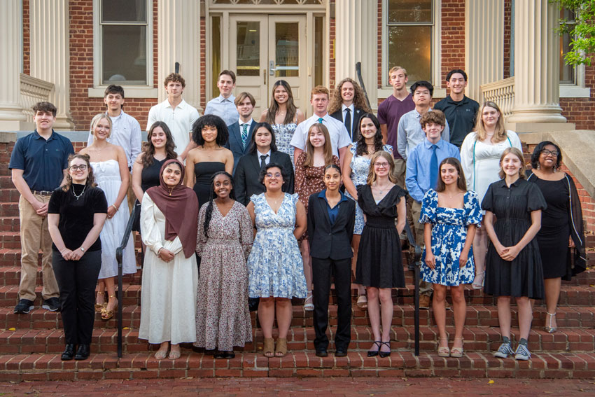 Group of senior honors recipients standing on stairs