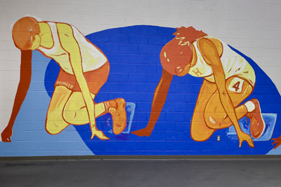 Mural of track runners at starting line
