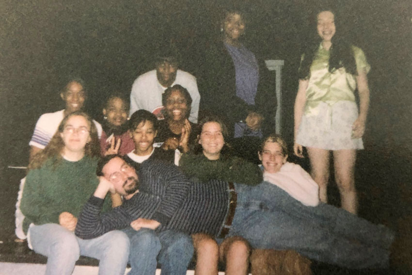 Snapshot of teacher with students from 1997
