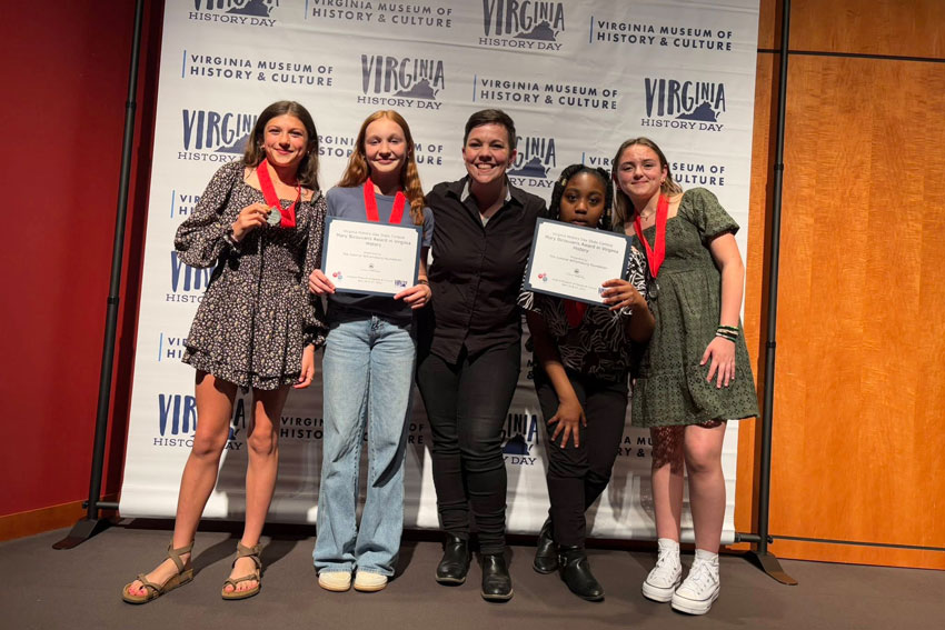 Students holding awards at Virginia History Day competition