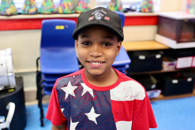 Student wearing drumline hat