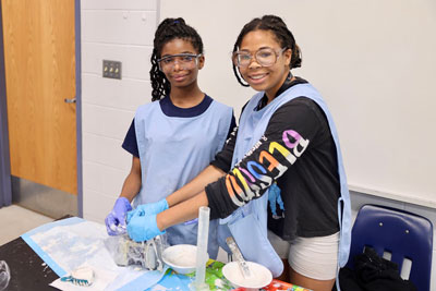 Two student working to create dental mold