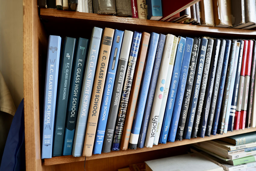 Numerous E. C. Glass High School yearbooks on bookshelf