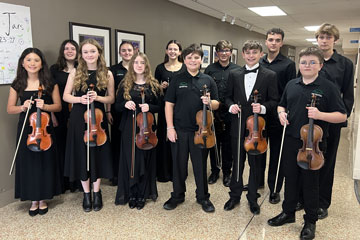 Group of 12 secondary students in concert attire holding stringed instruments