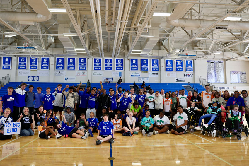 Entire E. C. Glass and Heritage/Laurel Medford League basketball teams together on court with coaches