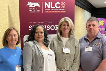 LCS Director of School Nutrition Beth Morris with three colleagues at SNA National Leadership Conference 