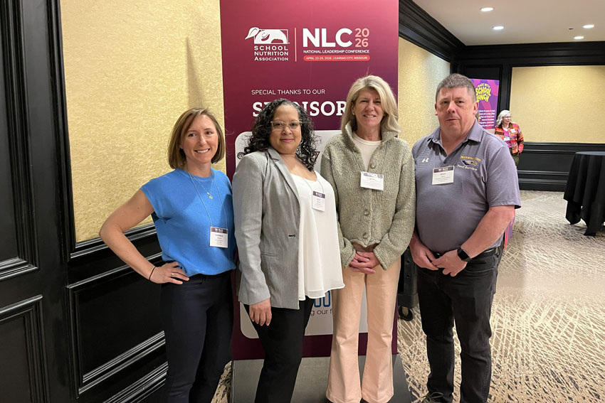 LCS Director of School Nutrition Beth Morris with three colleagues at SNA National Leadership Conference
