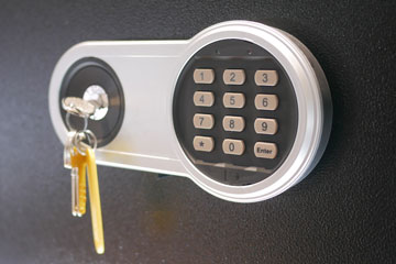 Closeup of safe with keypad and key