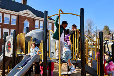 Pre-k students playing on new playground