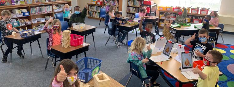Masked students in the library