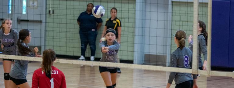 Volleyball player bumping ball