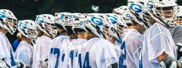 Boys lacrosse players lined up