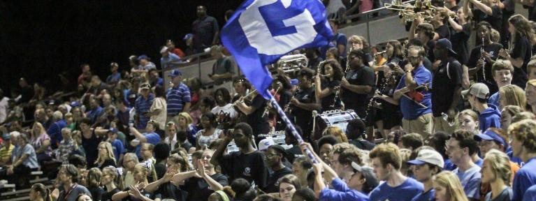 Blue flag waving over crowd at City Stadium