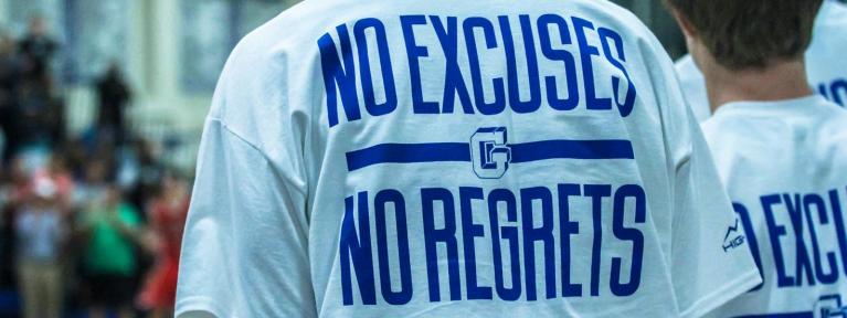 Shirt that reads "No Excuses No Regrets"