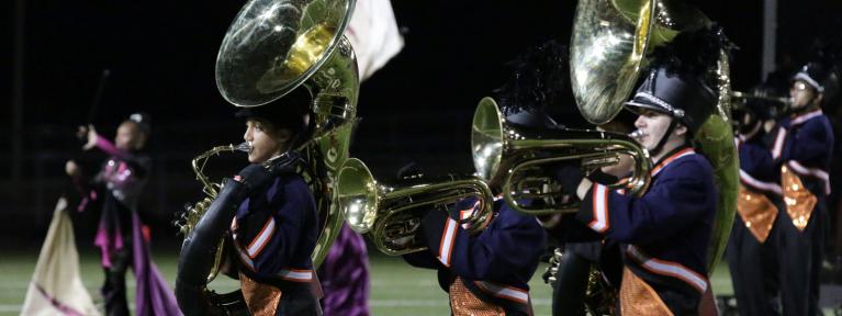 Marching band on field performing