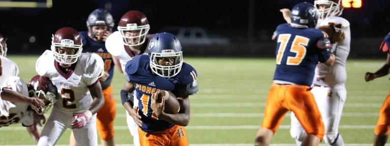 Running back breaking through line