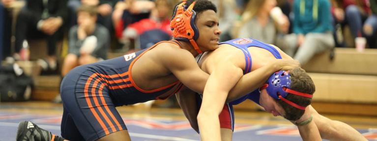 Wrestler with opponent in hold