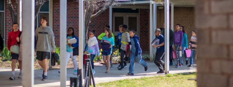 Students outside using covered walkway