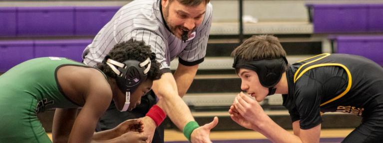 Wrestlers at start of match with referee