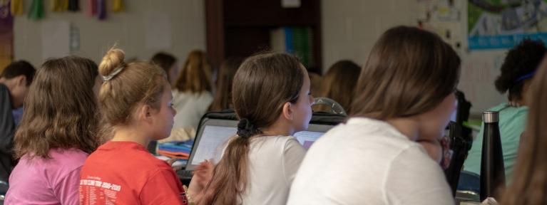Girls using Chromebooks in class