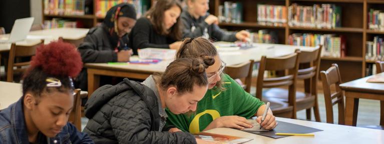 Girls working in the library