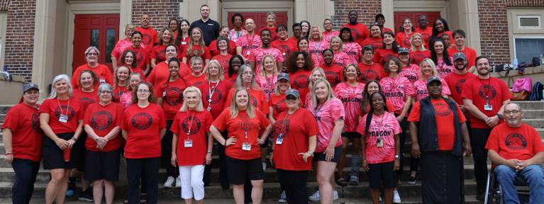 Staff group photo standing on steps