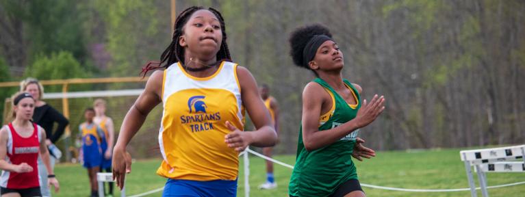 Girls running on track